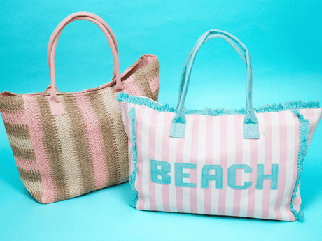 NEW! Bags - 2 straw beach bags on a aqua background