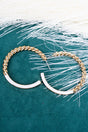 Dramatic Twist White & Goldtone Hoop Earrings - Wholesale Accessory Market
