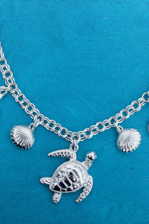 Waikiki Turtles & Shells Silvertone Charm Necklace and Earring Set - Wholesale Accessory Market