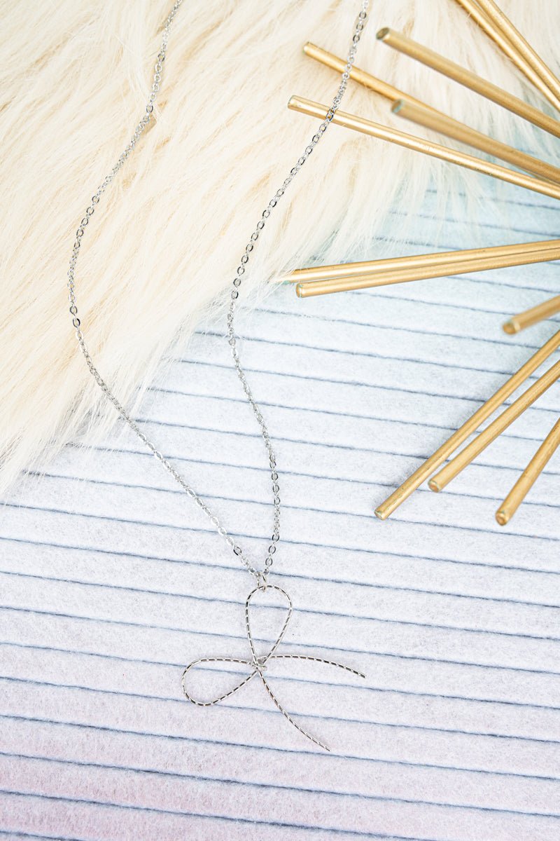 Crystal Avenue Silvertone Knot Your Average Bow Necklace - Wholesale Accessory Market