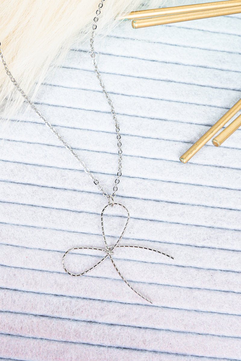Crystal Avenue Silvertone Knot Your Average Bow Necklace - Wholesale Accessory Market