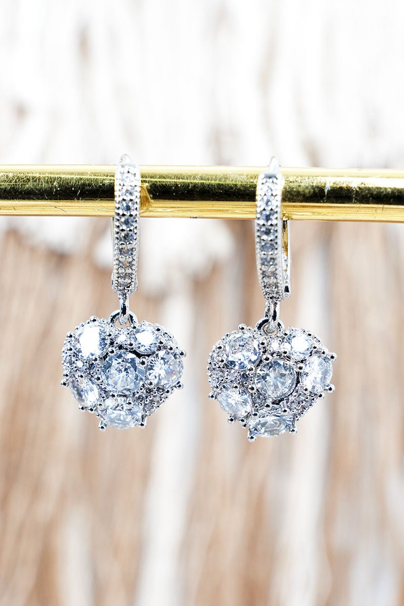 Crystal Avenue Heart of Elegance Cubic Zirconia Silvertone Huggie Hoop Earrings - Wholesale Accessory Market