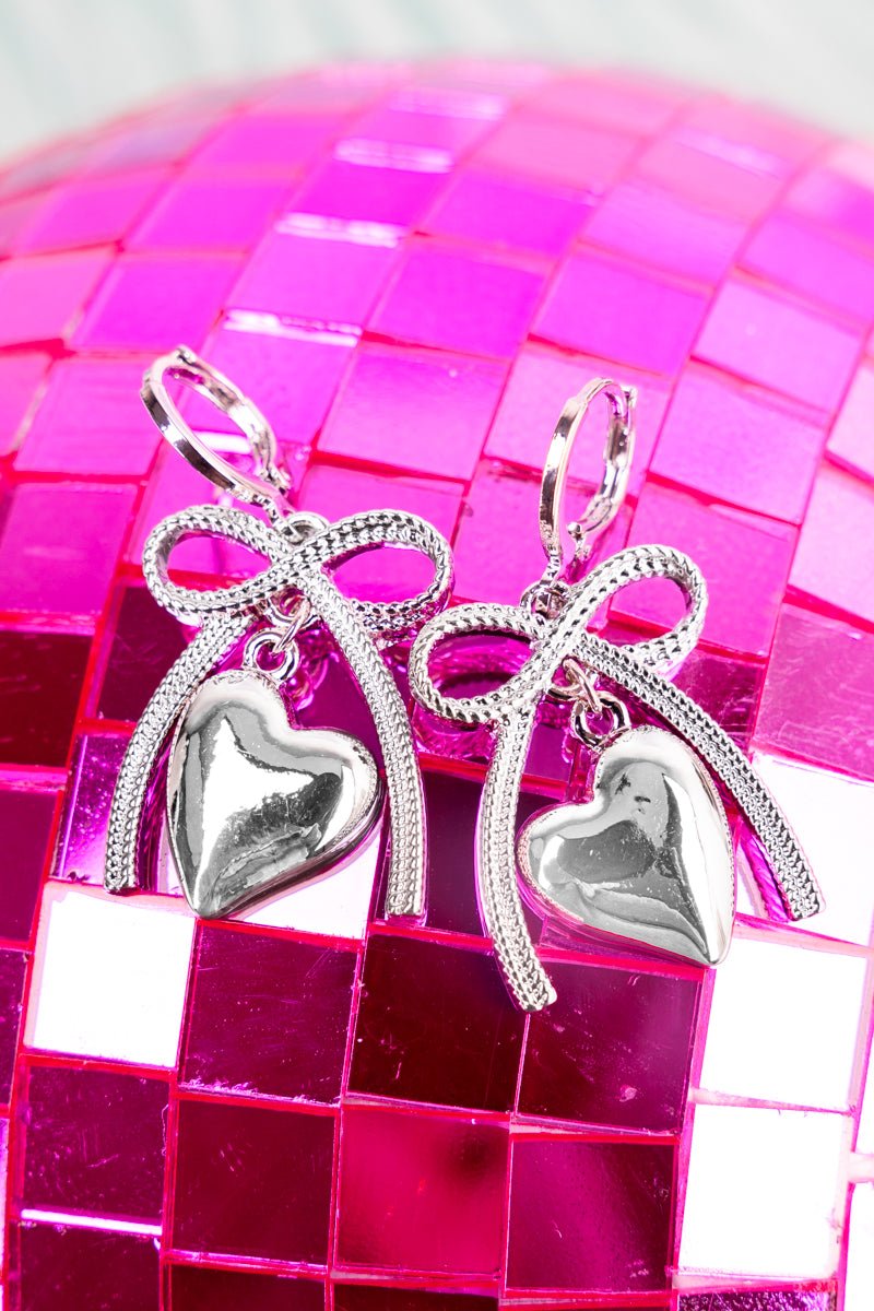 Crystal Avenue Coquette Love Silvertone Huggie Hoop Earrings - Wholesale Accessory Market