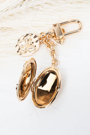 Crystal Avenue Goldtone Rose Reverie Locket Bag Charm - Wholesale Accessory Market