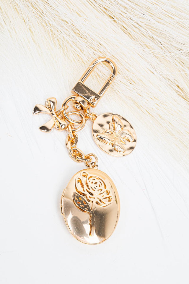 Crystal Avenue Goldtone Rose Reverie Locket Bag Charm - Wholesale Accessory Market