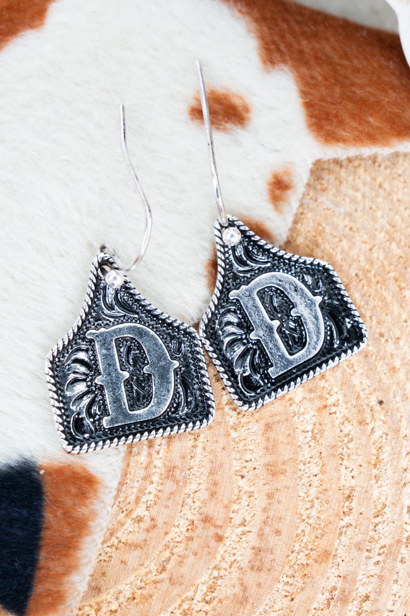 TIPI Cattle Tag 'D' Silvertone Earrings - Wholesale Accessory Market