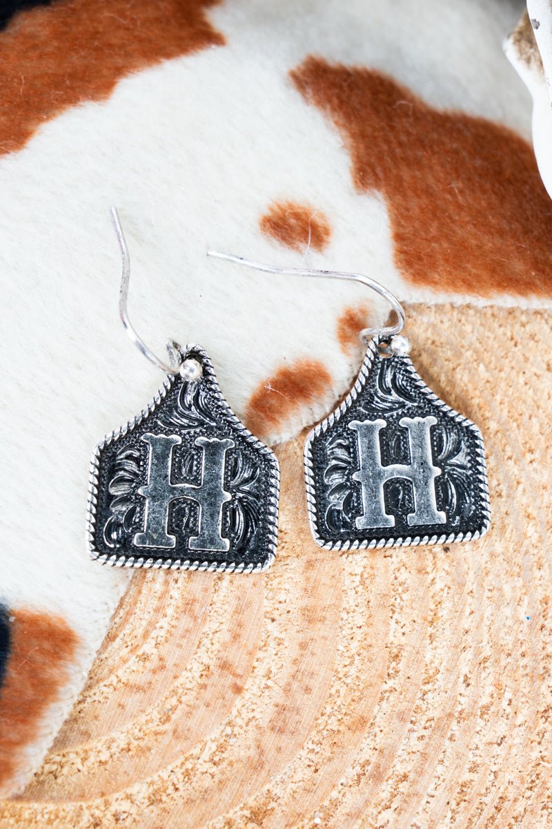 TIPI Cattle Tag 'H' Silvertone Earrings - Wholesale Accessory Market