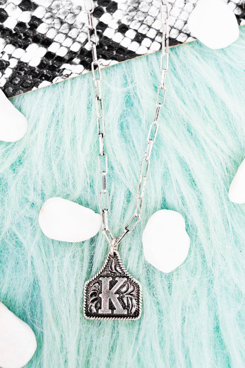 TIPI Cattle Tag 'K' Silvertone Necklace - Wholesale Accessory Market