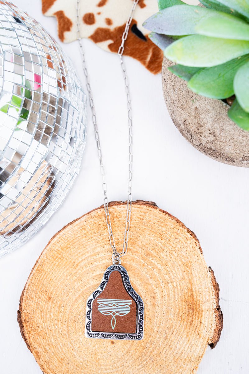TIPI Turquoise Signature Stitches Brown Cattle Tag Silvertone Necklace - Wholesale Accessory Market