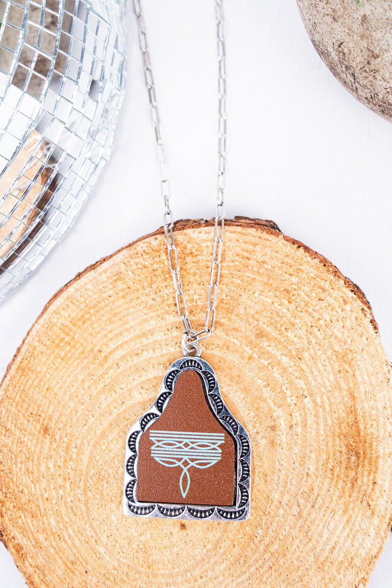 TIPI Turquoise Signature Stitches Brown Cattle Tag Silvertone Necklace - Wholesale Accessory Market