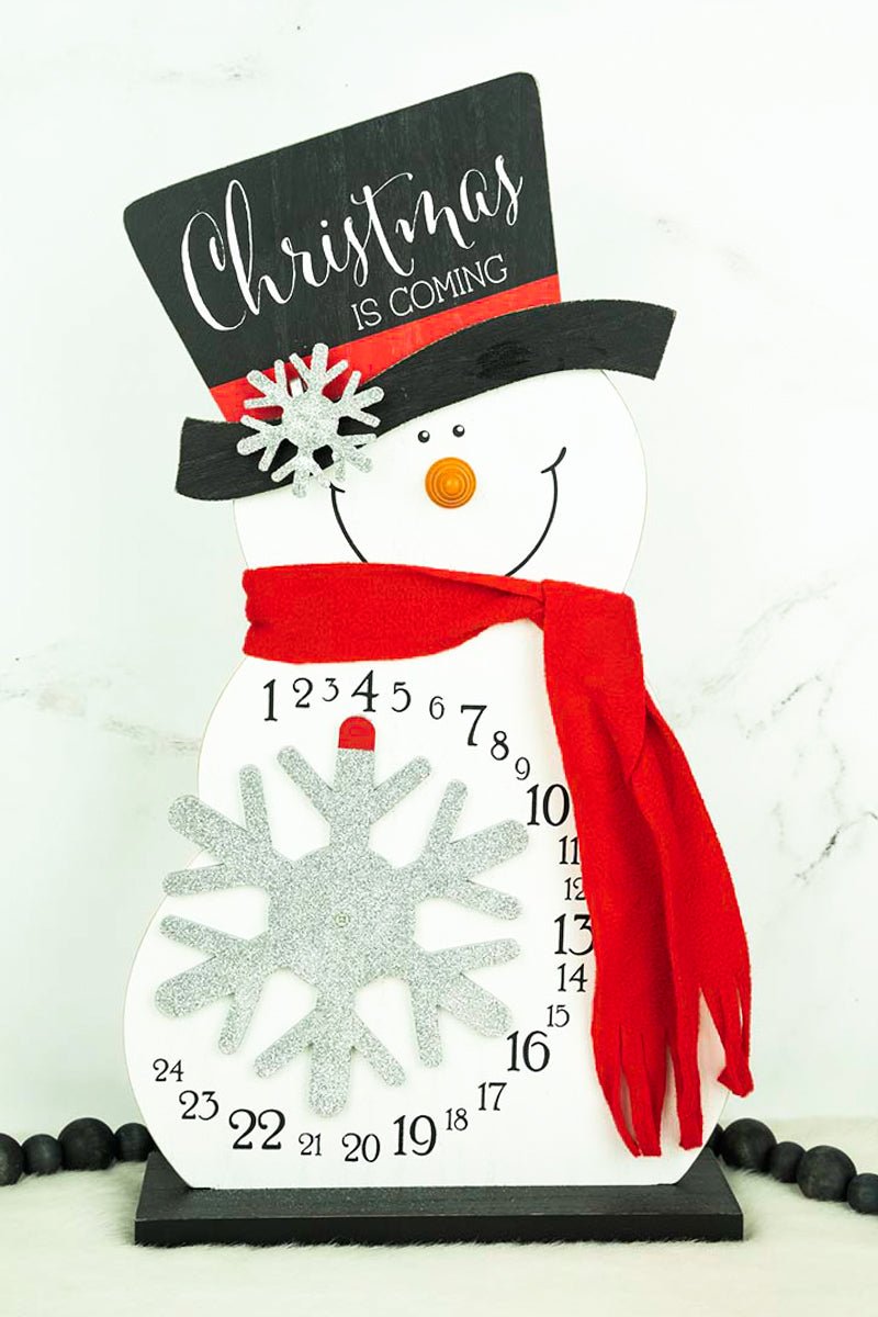 https://www.wholesaleaccessorymarket.com/cdn/shop/products/920361975-x-1075-christmas-countdown-snowman-216017_1200x.jpg?v=1684858861