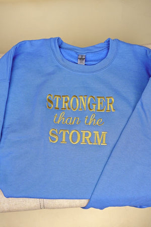 Embroidered Stronger Than The Storm Unisex NuBlend Crew Sweatshirt - Wholesale Accessory Market